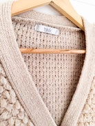Cardigan bouclé beige Twik – seconde main