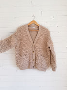 Cardigan bouclé beige Twik – seconde main
