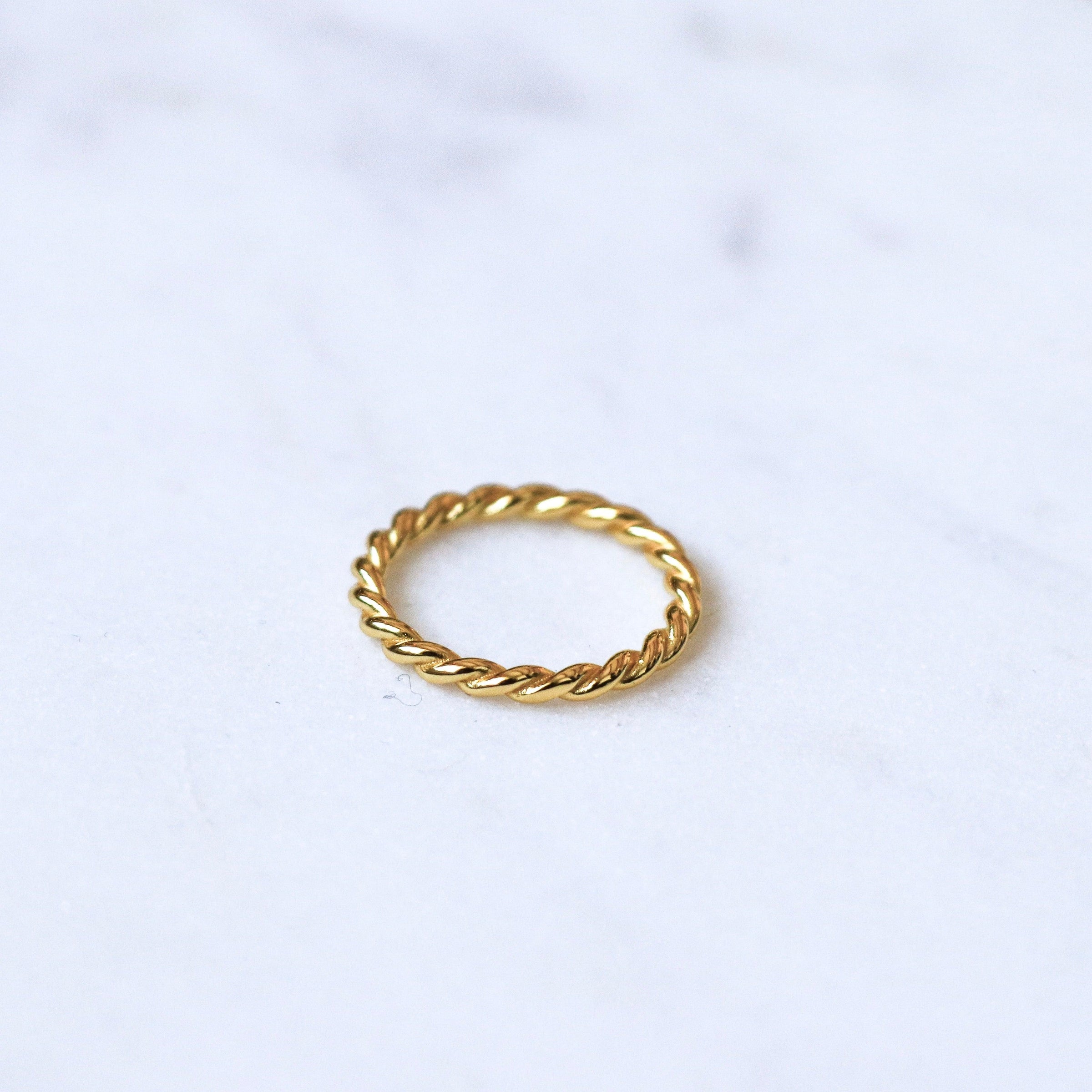 LOUIS VUITTON. Gold-plated ring twisted in the shape of …